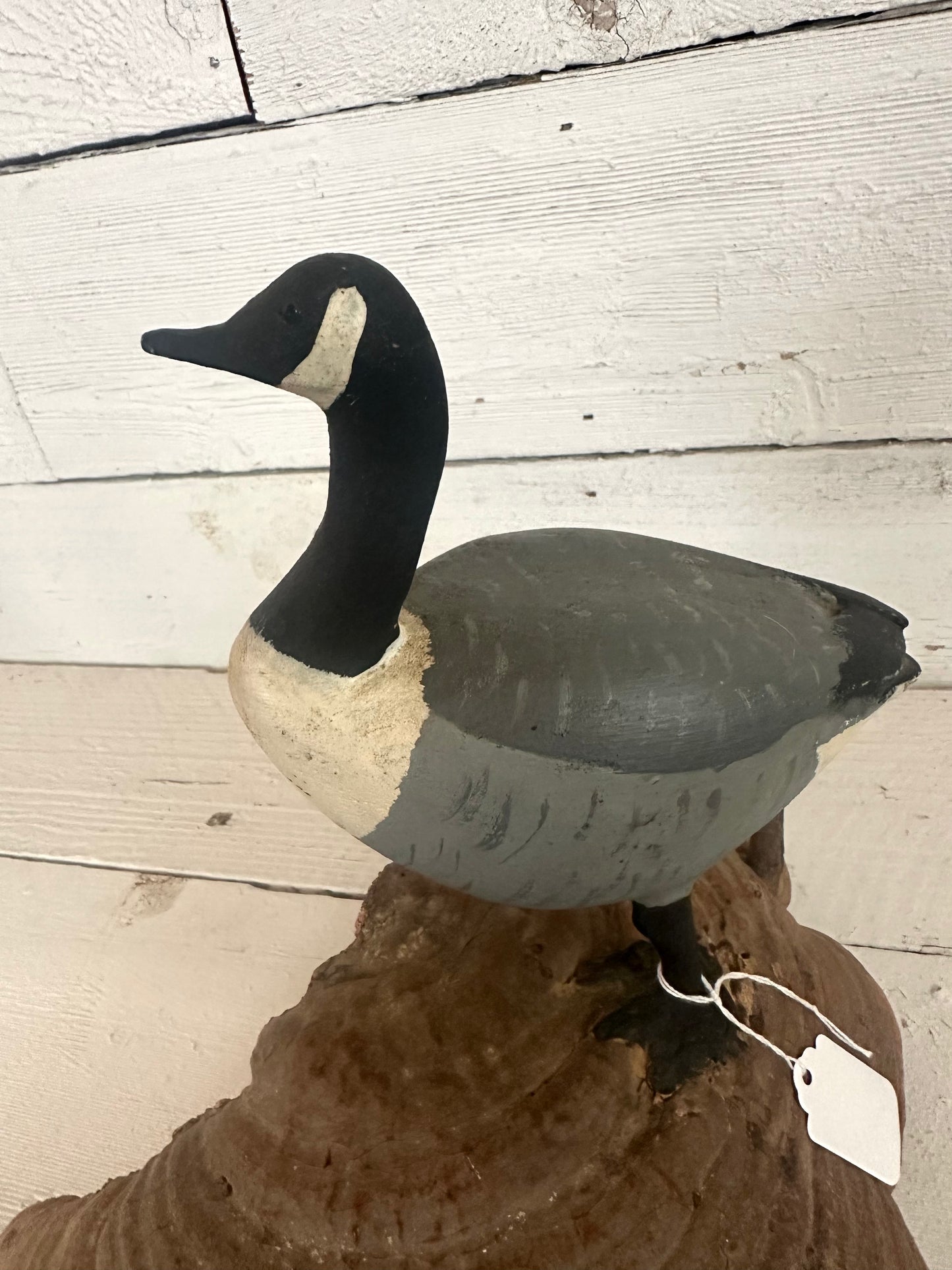 Carved Wooden Goose on Natural Material
