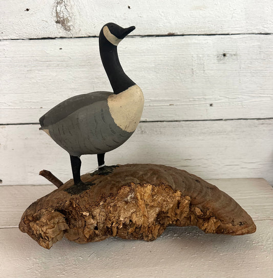 Carved Wooden Goose on Natural Material