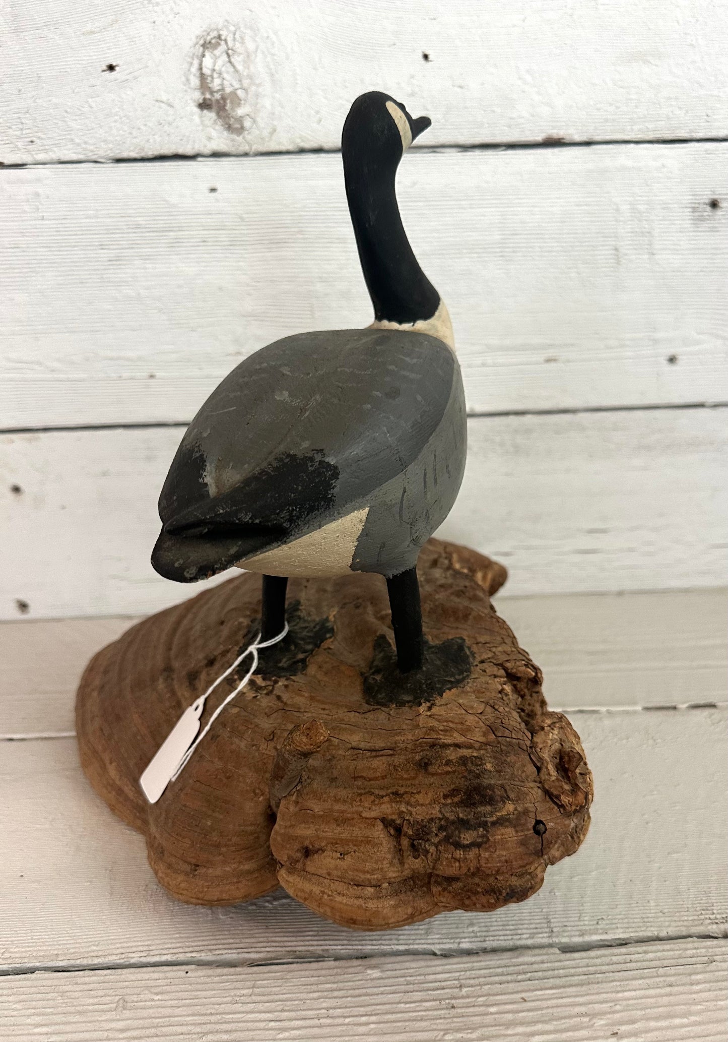 Carved Wooden Goose on Natural Material