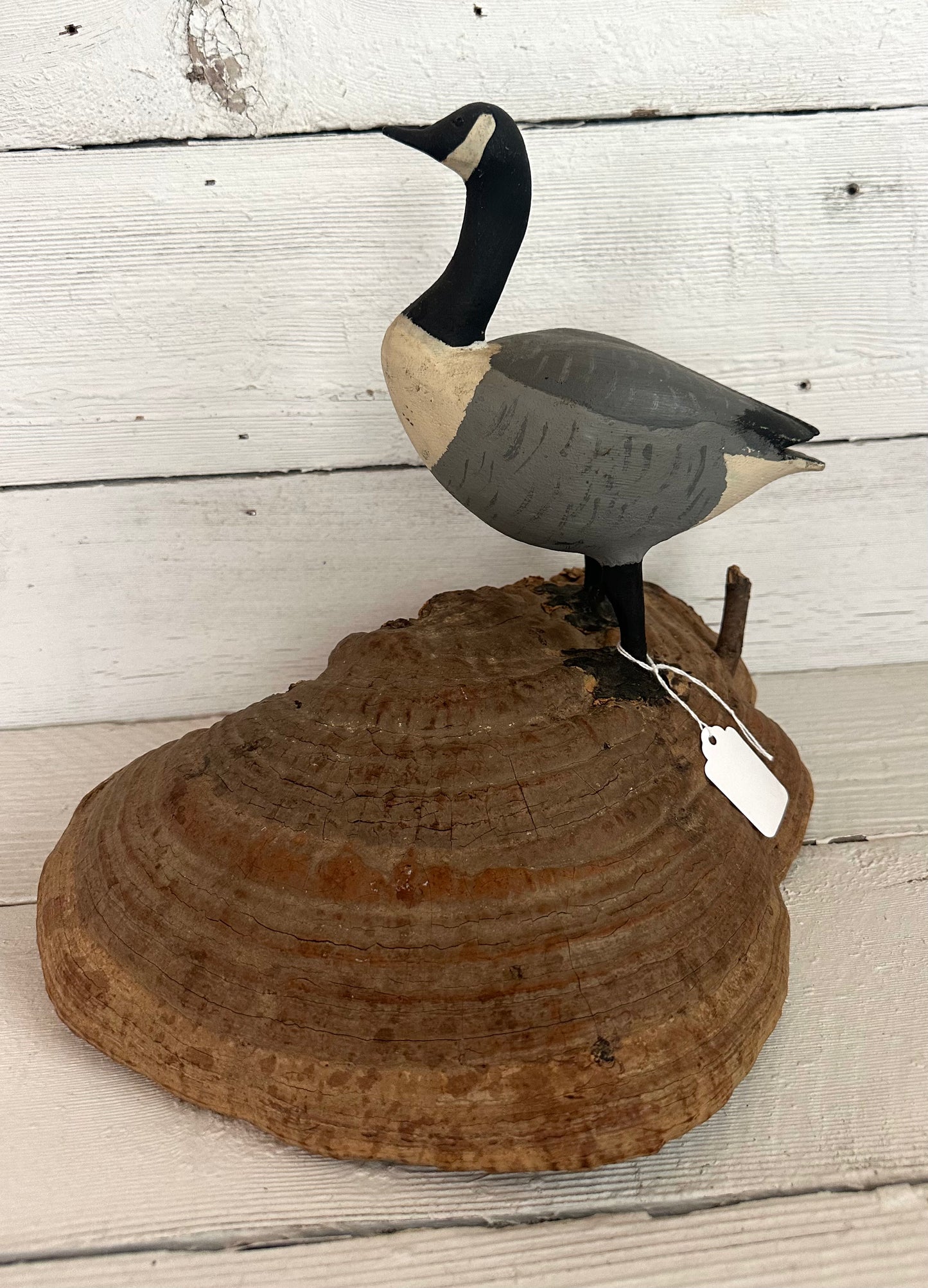 Carved Wooden Goose on Natural Material